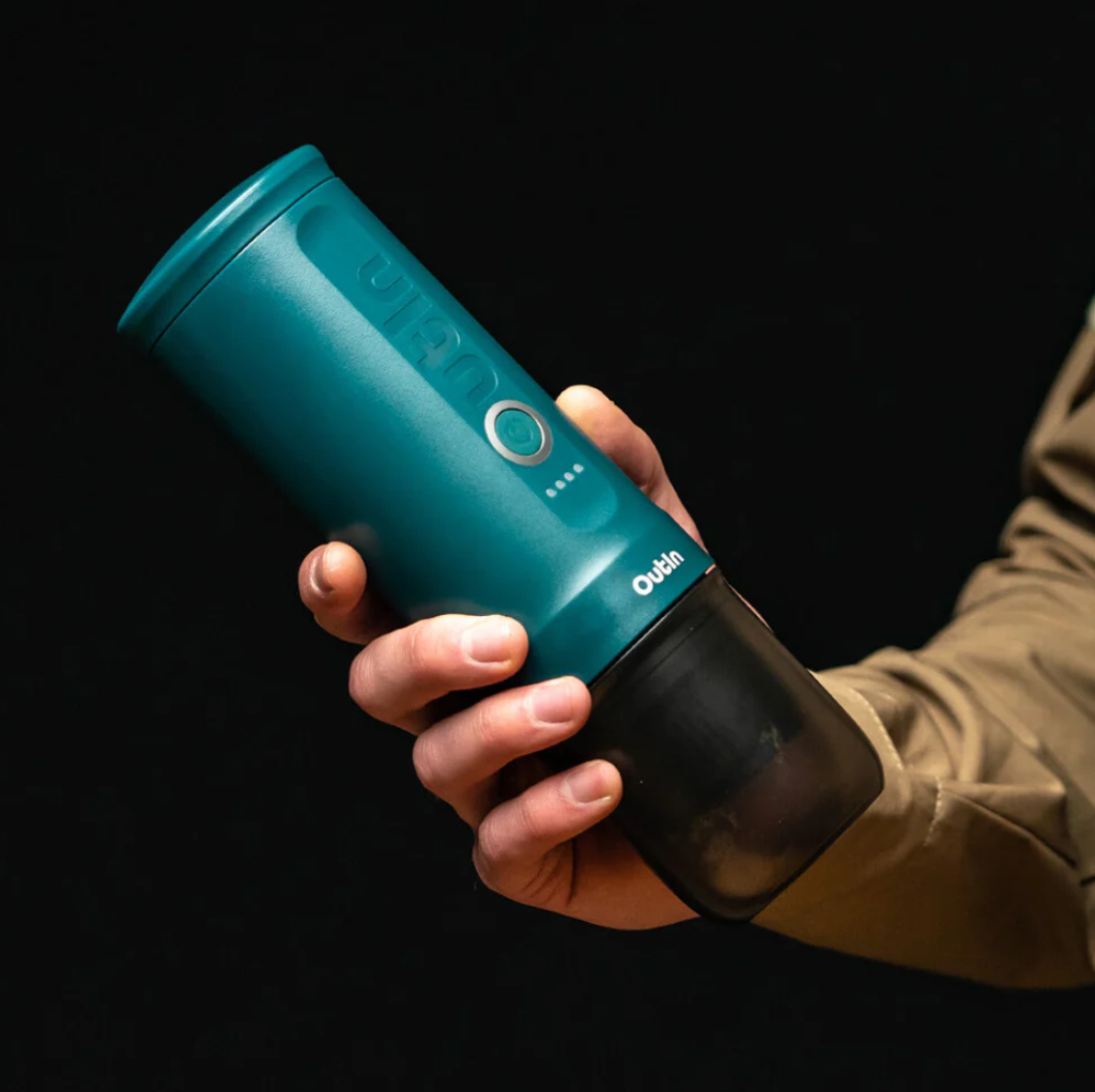 enjoying the teal Nano Portable Espresso Machine