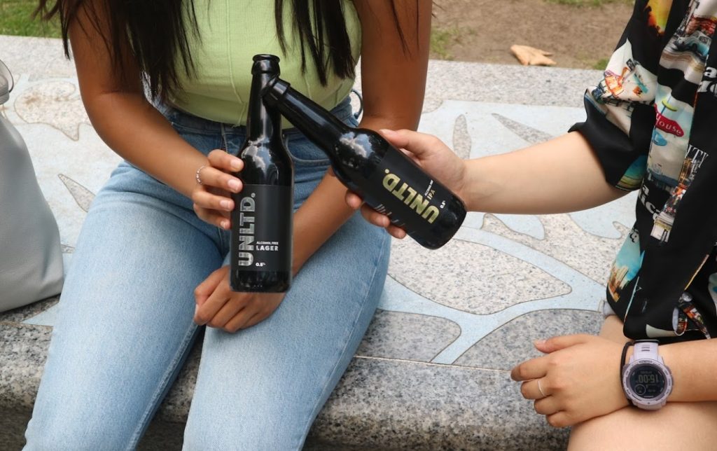 family on a picnic enjoying UNLTD's alcohol-free beer