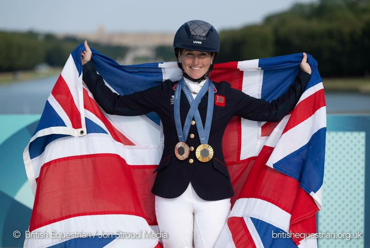laura collett posing with her olympic gold medals