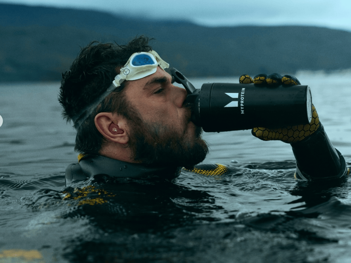 Ross Edgley holding a Myprotein shaker