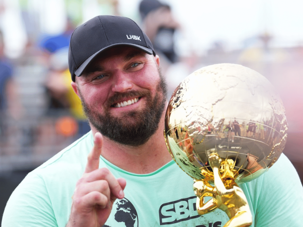 Mitchell Hooper lifts the trophy